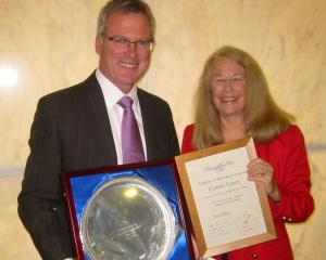 Miss Lawn is photographed in The Beehive in 2006 receiving her National Press Club Lifetime Achievement Award from Minister of Broadcasting Steve Maharey.