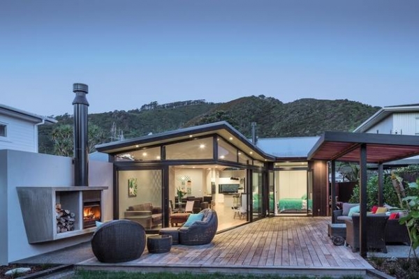 With hills behind and the sea ju