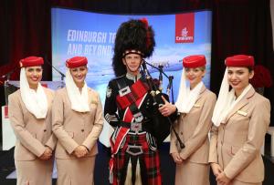 Emirates is welcomed to Edinburgh Airport by a Scottish bagpiper.
