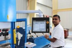 Kevi Reddy at the controls of a state of the art CNC machine in Nadi.