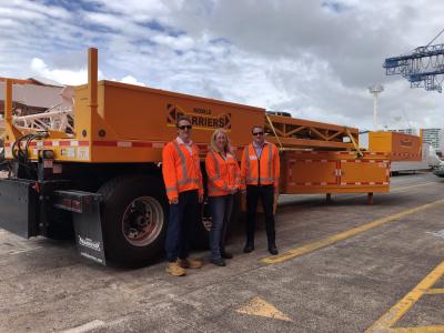 Gary Bonser, AMA Maintenance Manager, Jennifer Hart, Acting AMA Director and Paul Geck, NZTA Acting System Manager take delivery of the MBT-1 mobile motorway barrier.